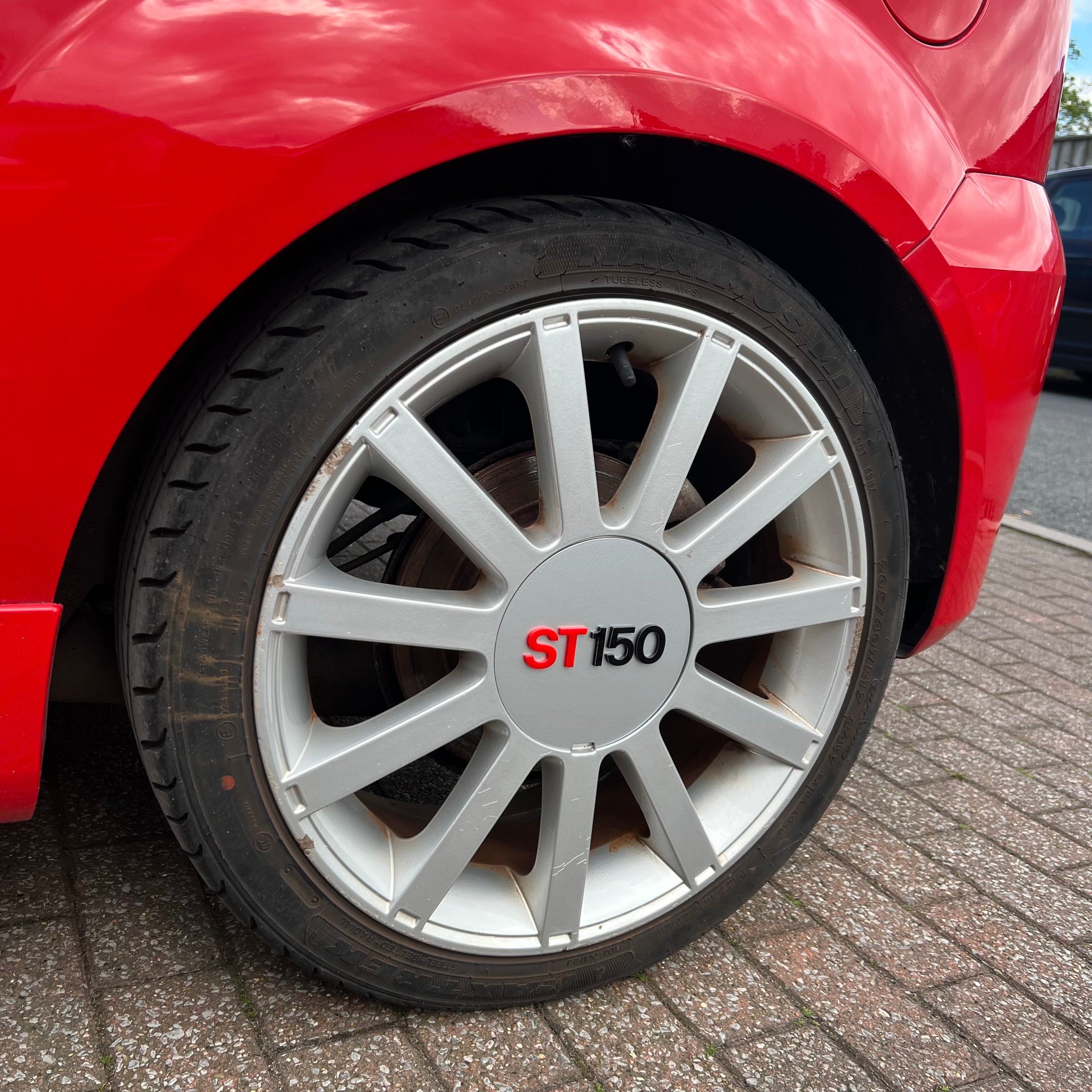 Proform Mk6 Fiesta ST150 Wheel Centre Caps - Set of 4 - Painted Moondust Silver with Red/Black ST150 Text