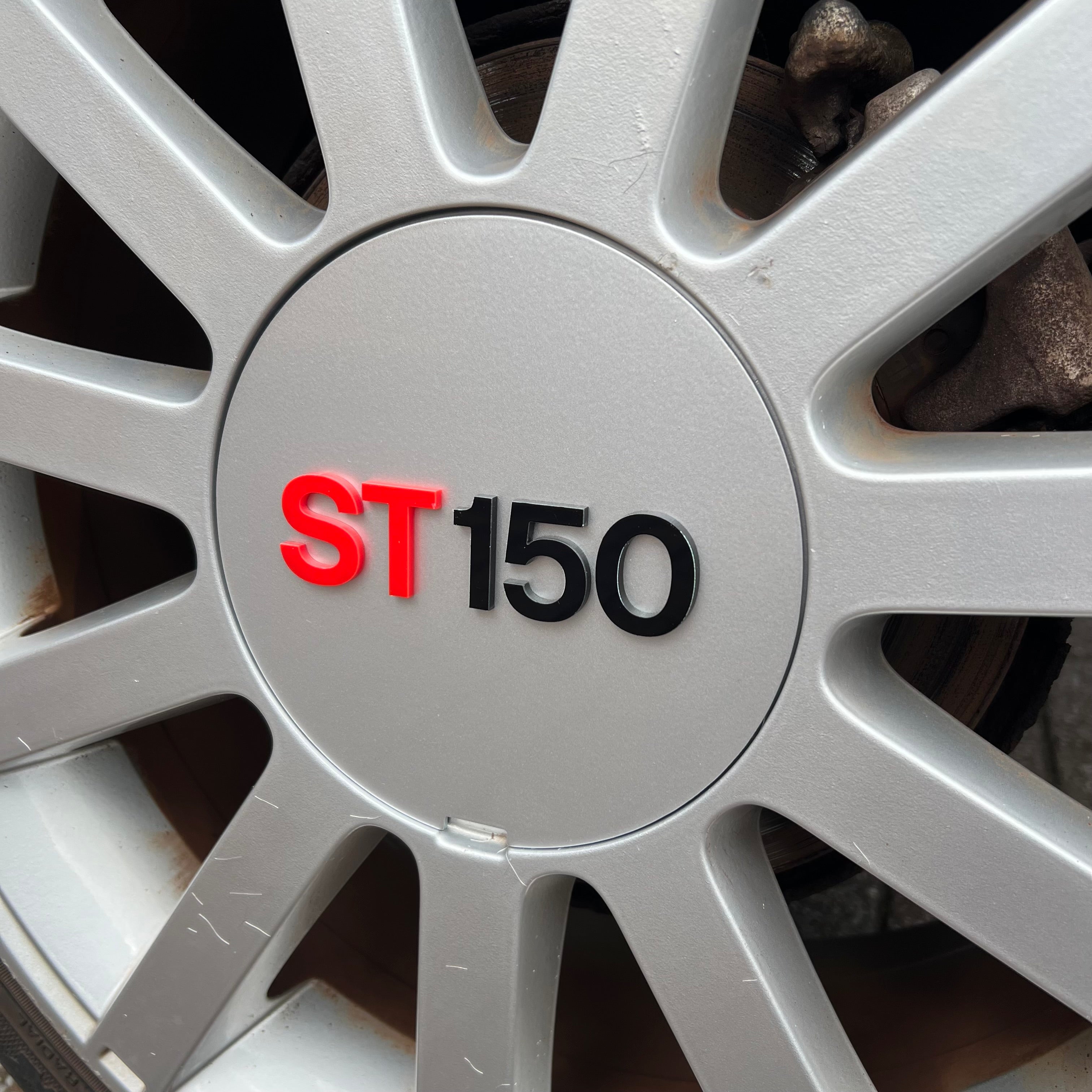 Proform Mk6 Fiesta ST150 Wheel Centre Caps - Set of 4 - Painted Moondust Silver with Red/Black ST150 Text